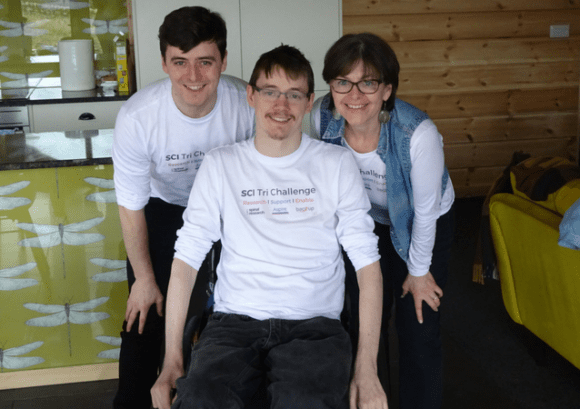 Sam, Sarah and Andrew smiling while wearing their SCI Tri Challenge t-shirts