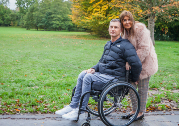 Terry, a wheelchair user, and his partner. Read on for his 2020 impact report story.