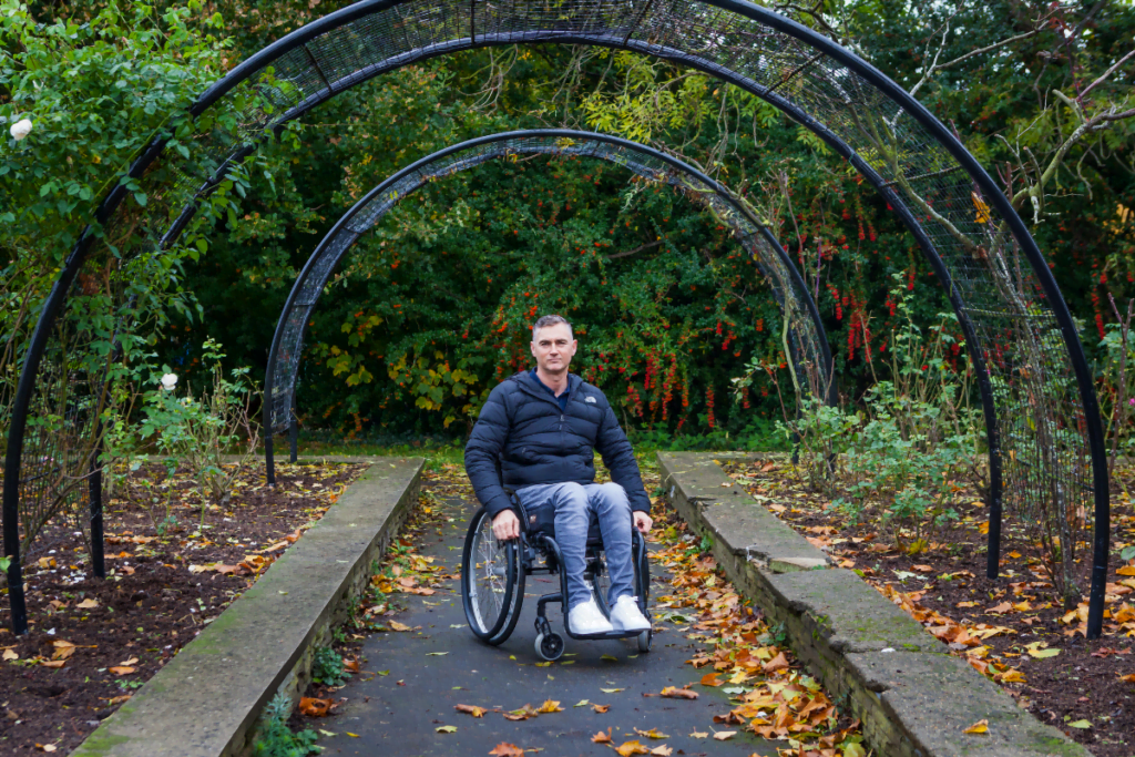 Terry, a wheelchair user in a park. Read on for his 2020 impact report story.