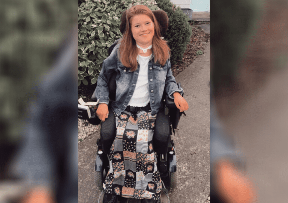 Bel, a young powerchair user with a high level spinal cord injury