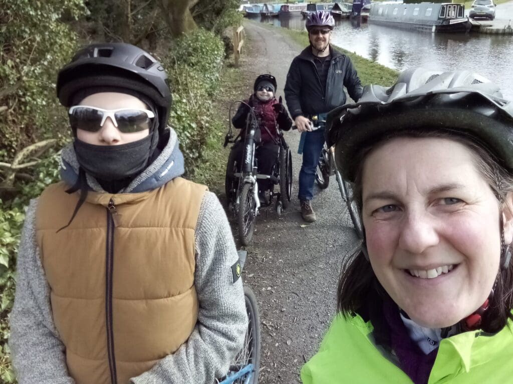 Peter and his family enjoying a family bike ride together