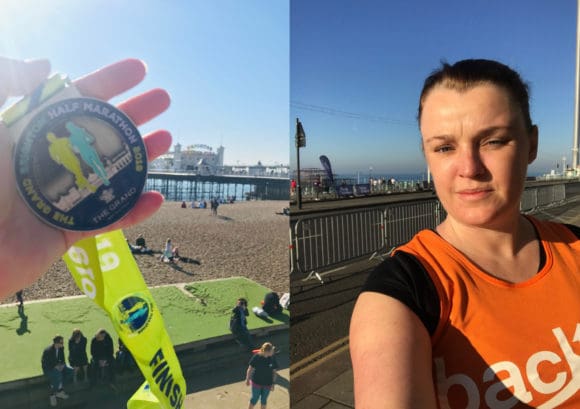 Lisa and her finishers medal at the Brighton half marathon