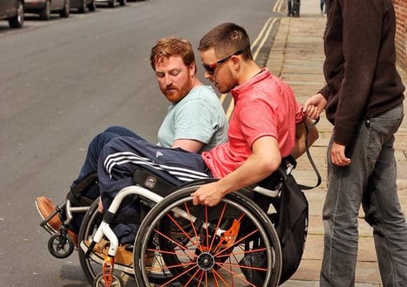 Wheelchair user going down a kerb