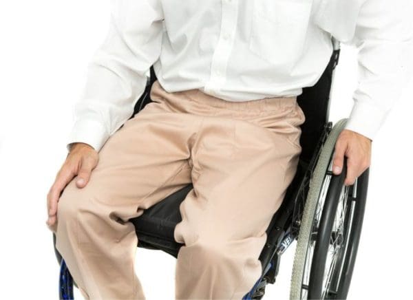 wheelchair user wearing stone coloured chinos